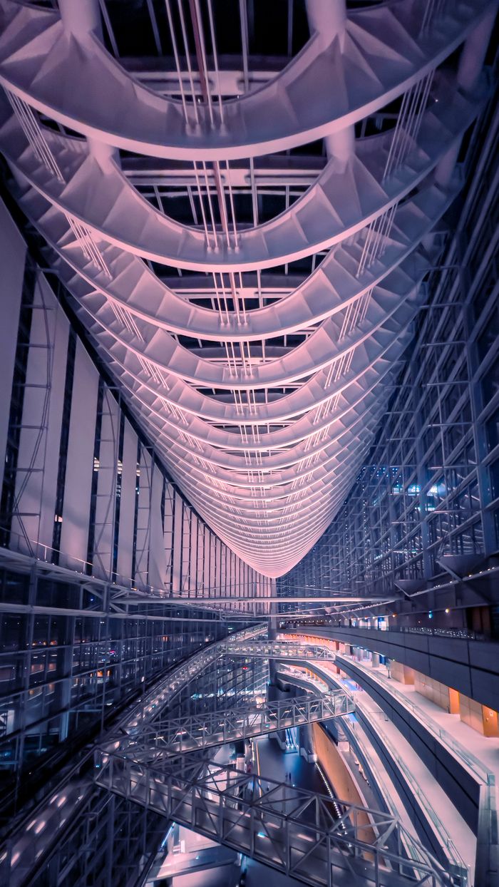 A stunning view of the modern atrium with a curved architectural design in Chiyoda City, Tokyo.